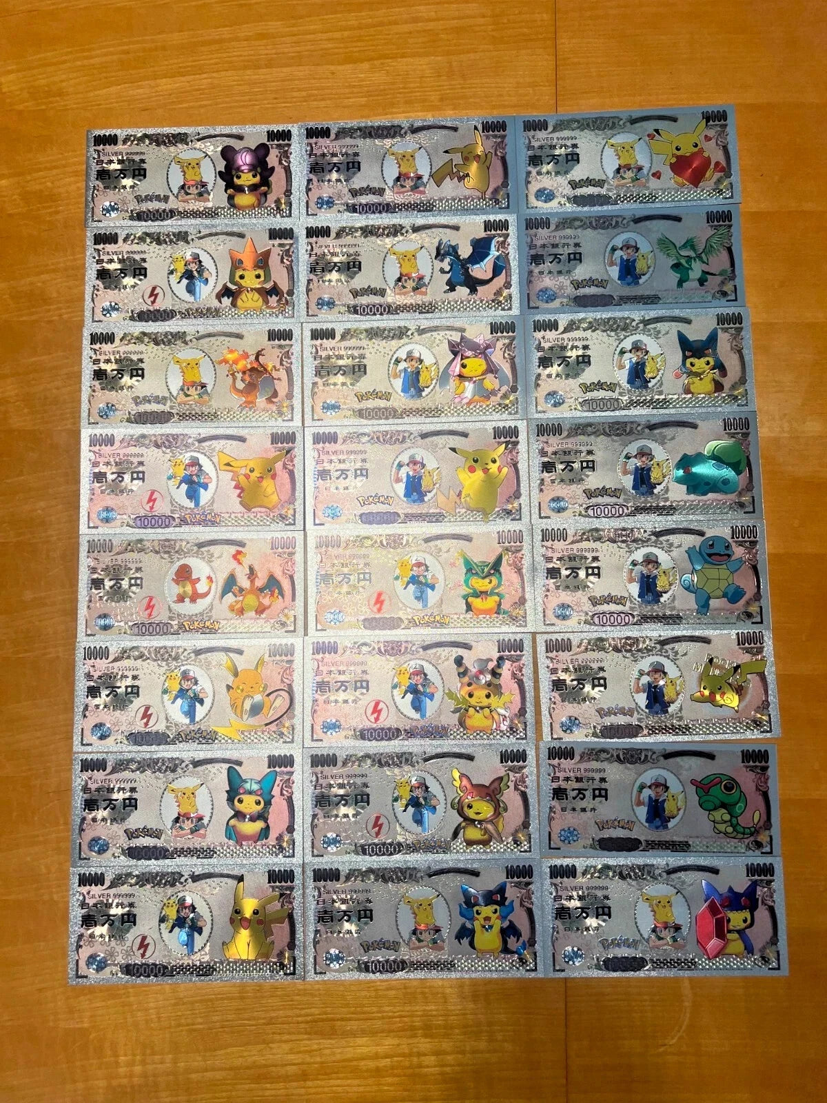 Pokemon Silver Foil Banknote Set of 24 Charizard Pikachu Poncho